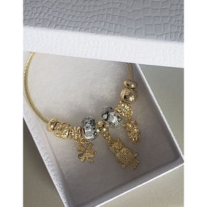 18k Gold Finish Stainless Steel Titanium Flex Bracelet\nOwls/Clover/Butterfly